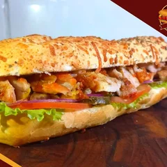 Churrasco no Pão Frango (COXA E SOBRECOXA - BAGUETE PARMESÃO 20cm)