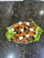 Porção  de filé de Tilápia á Milanesa 