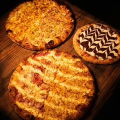 2 Pizzas Grandes + Broto + Kuat 2l Grátis