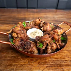 Porção de Frango a passarinho