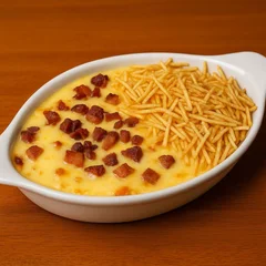 Batata Recheada de Carne Seca com Creme Gorgonzola, Muçarela, Bacon e Batata Palha 